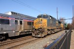 CSX 874 leads M409